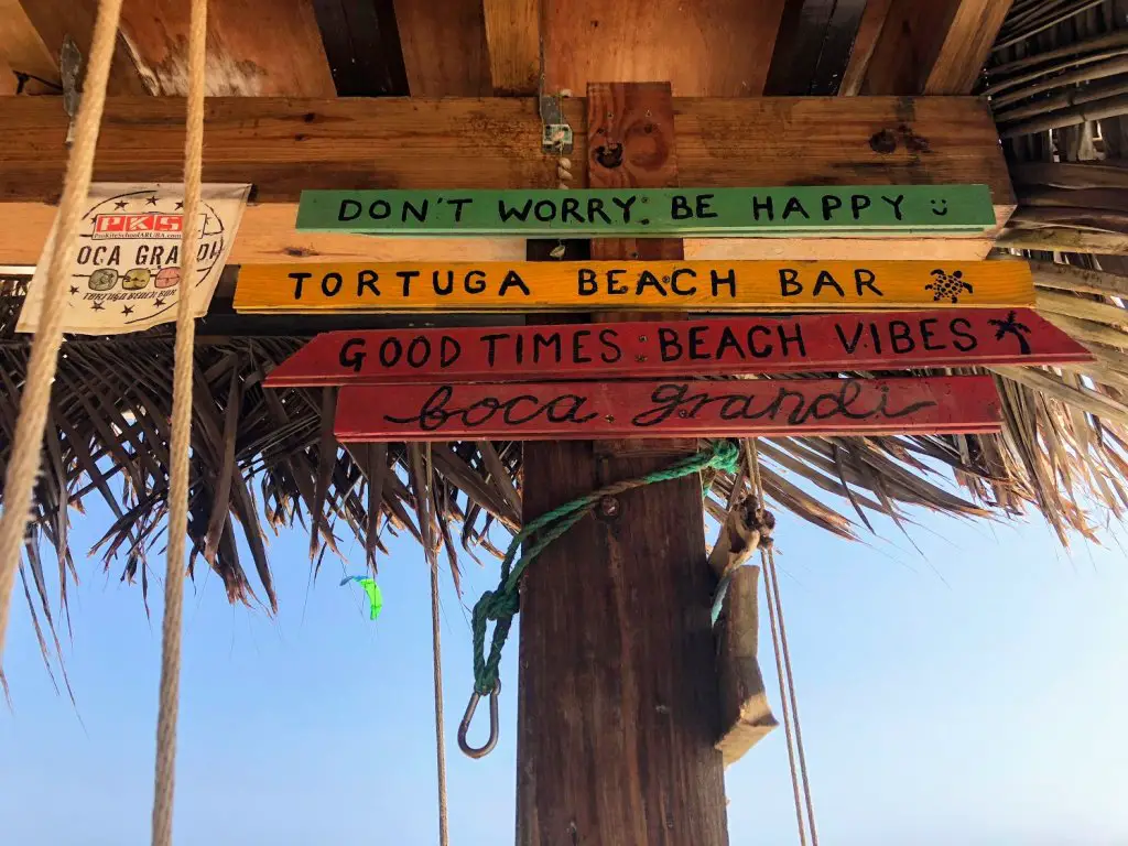 boca grandi kite surfing beach bar sign - don't worry be happy aruba beach day in aruba