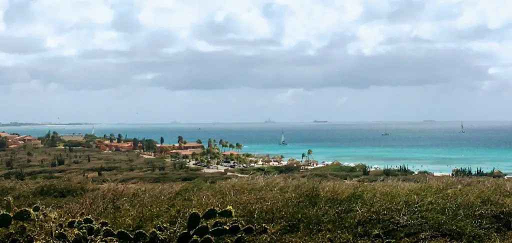 view of sand dunes and ocean from california lighthouse, aruba