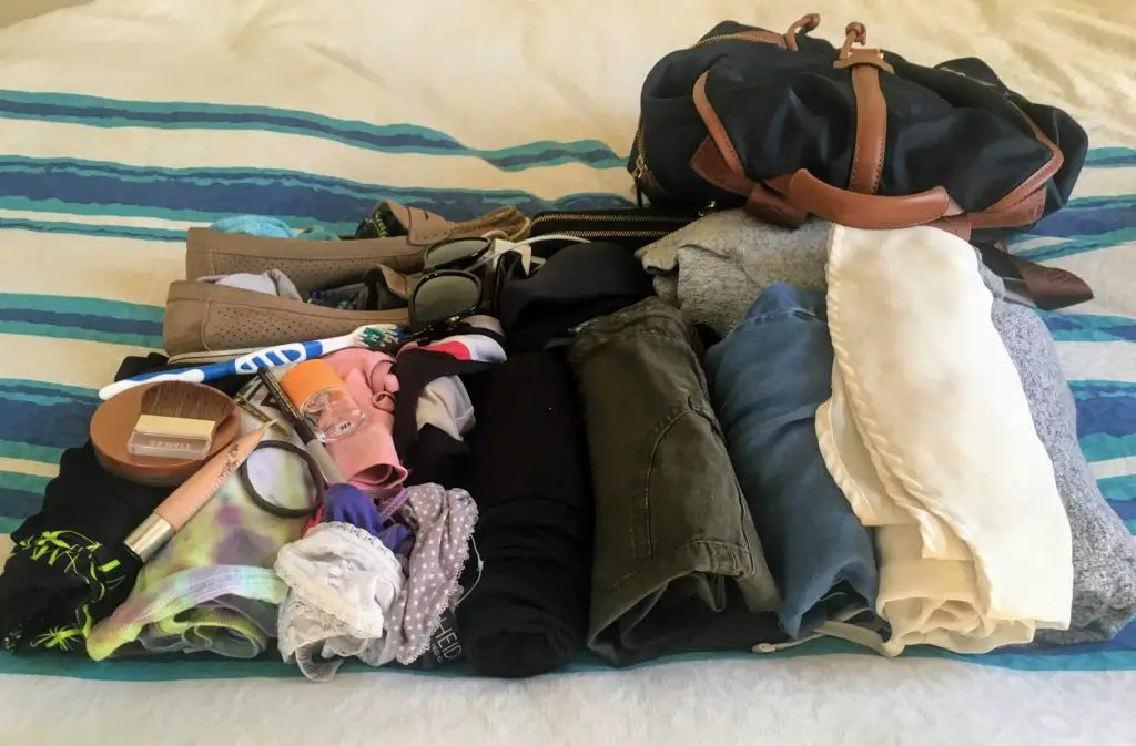 clothes and backpack for packing early to reduce travel stress