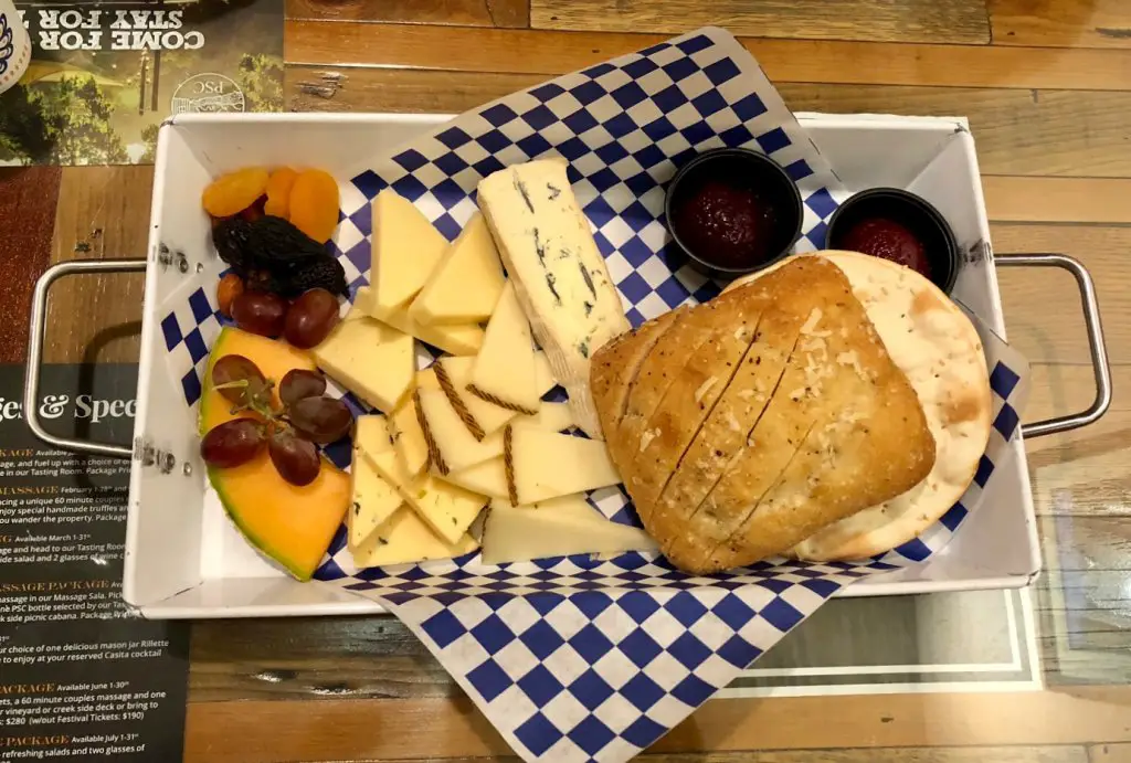 cheese plate including fruits cheeses breads and jelly from page springs cellars